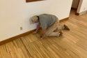 It’s important to make sure the edges are abraded just as well as the field. Here, Scott Bowman of Bowman’s Hardwood Floor Refinishing abrades the edges on a floor made of cutoffs from trailer flooring.