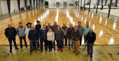 The working group for what is now the Indoor Sports Surfaces Division of the American Sports Builders Association at the Praters facility in Chattanooga, Tenn., in January included (from left): Tim Young, Basic Coatings; Ashton Salinger, Basic Coatings; McKenzie Nelson, Western Sport Floors; John Prater, Praters; Paul Nelson, Western Sport Floors; Rob Zehnder, PoloPlaz; Steve Yoder, The Ohio Floor Company; Cassie Wilson, Praters; Larry Wade, The Ohio Floor Company; Abby Mitchell, Ponder Company; Kevin Miller, The Ohio Floor Company; Paul Hildebrandt, Creative Floors; Jay Hendley, Covington Floors; Logan Allen, Allen Hardwood Floors; Mike Allen, Allen Hardwood Floors; and Phil Sanchez, Bona.