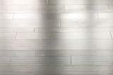 A 16-gauge staple was used on this 1/2-inch-thick engineered floor, causing the dimples you see.