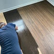 Wood floor coloration options are as varied as their application techniques; here a solvent-based stain is being applied.