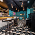 The hand-crafted parquet steals the show in this basement hangout.