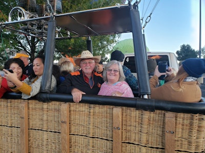 Janet Sullivan and her husband Mark plan to travel even more now that she has retired; here they are pictured at the Hot Air Balloon Fiesta in Albuquerque, N.M., last October.