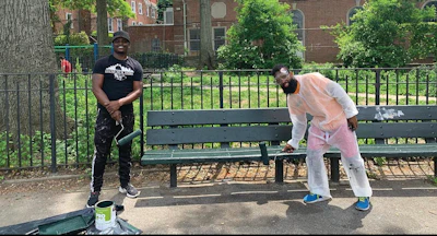 Barrow (left) helps to refurbish benches in Old Fort Four Park.
