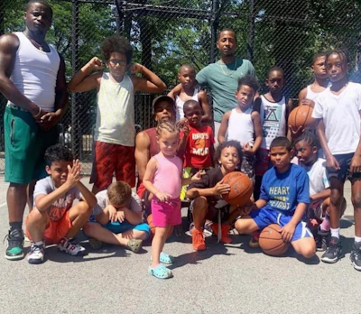 Barrow (left) with some of the children involved in Theory 9's program.
