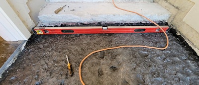 This project from last year required me to flatten a concrete entry that was pock-marked like the inside of an English muffin. My intent was to have a finished elevation that allowed for my ¾-inch solid oak floor to be flush with the existing guest bath on one side and the guest closet on the other side.