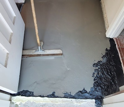 Then I used a cementitious leveling compound poured over the slab to the finished height where it barely covered the Tapcon screw heads.