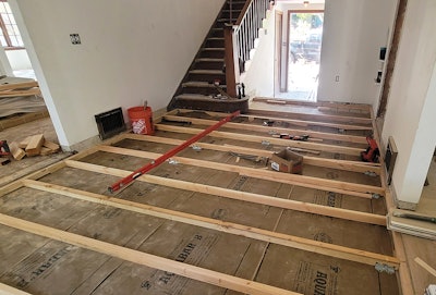 We installed 2x4s 12 feet long for the spans to make the elevation work, and kept the level and laser at hand to make every board count.