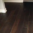 Relatively small gaps can appear more objectionable when the floor is stained dark and the lighter color of the wood appears in the gaps.