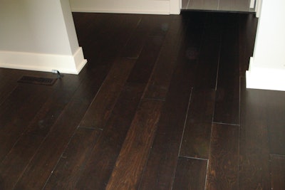 Relatively small gaps can appear more objectionable when the floor is stained dark and the lighter color of the wood appears in the gaps.