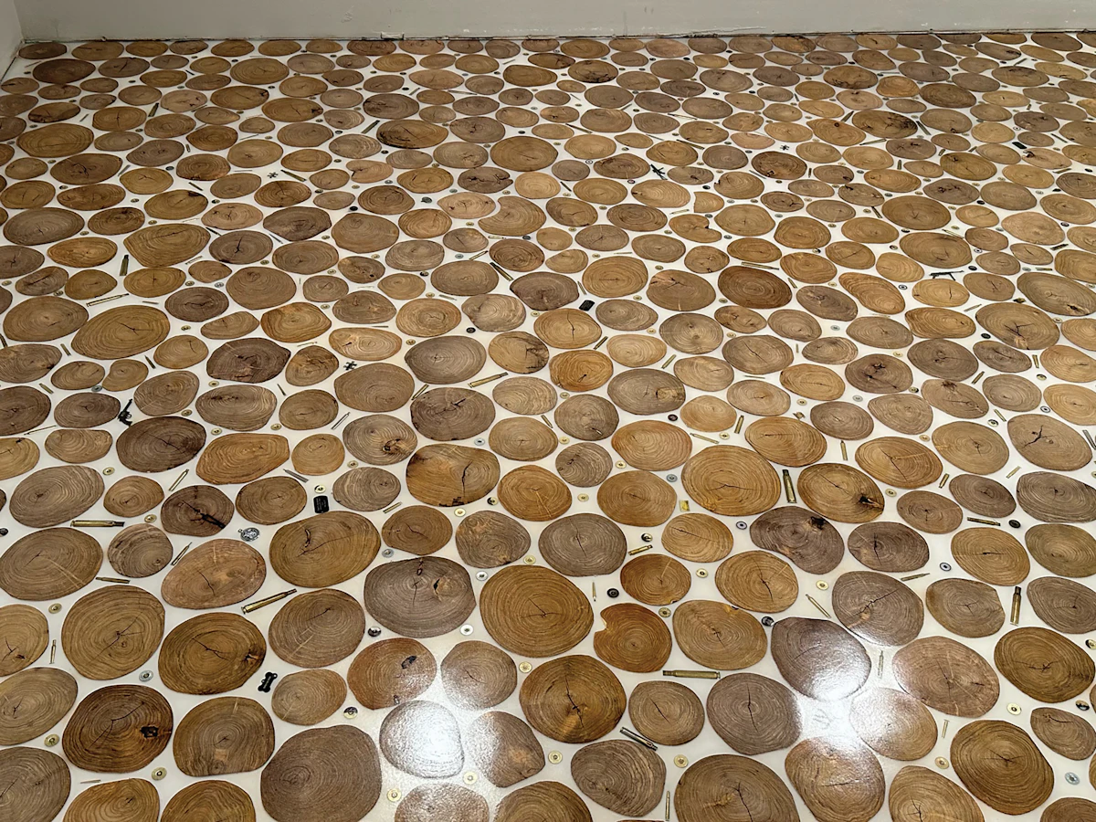 Log Rounds Are a Bullseye for Outdoorsman’s Floor | Wood Floor Business
