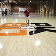 If basketball floors aren’t maintained correctly, including regular cleaning (as shown), they can become slippery.