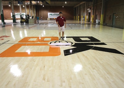 If basketball floors aren’t maintained correctly, including regular cleaning (as shown), they can become slippery.