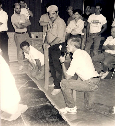 Mickey Moore (kneeling), teaches at the NOFMA school with John Bast Jr.
