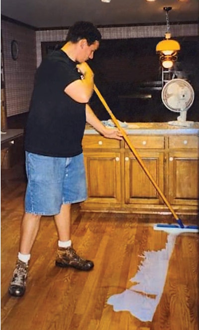 Wood flooring pro Rob Chewning of Southern Woods Flooring in Bethlehem, Ga., spreads waterborne finish in 1996 with a T-bar—an invention created specifically for the purpose of spreading waterborne finishes.