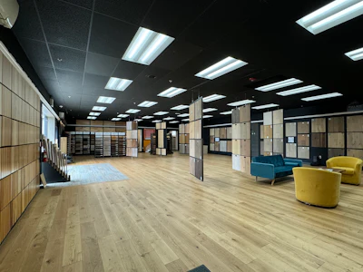 Atlantic Hardwood's showroom features black walls and ceilings that make the color and grain of the wood 'pop.'