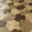 'Blooming' wood floor design is achieved by installing four unique shapes in a random pattern to generate a non-repetitive design.