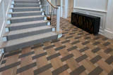 J. Rapaport Wood Flooring in New Jersey creates a tri-colored, tile-colored wood floor design.