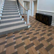J. Rapaport Wood Flooring in New Jersey creates a tri-colored, tile-colored wood floor design.