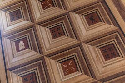 Emilio Manzano and his family created a pattern of family emblems to spread across their showroom floor.