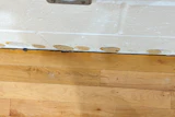 When gym flooring is tight against the walls, either there wasn’t enough expansion space to begin with, or site conditions have caused the flooring to swell.