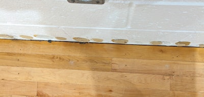 When gym flooring is tight against the walls, either there wasn’t enough expansion space to begin with, or site conditions have caused the flooring to swell.
