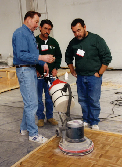 Lon Musolf (at left) teaches at a wood flooring school in San Francisco in February 2000.