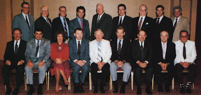 The 1990 National Wood Flooring Association board of directors: Back row (left to right): Claude Taylor, Red Peloquin, Pete Lanham, Ira Lefkowitz, Virgil Hendricks, Leonard 'Scotty' Wells, Larry Smith, Rick Brian, Harold Zuckerman. Front row (left to right): Keijo Hyvonen, Bill Price Sr., Jonny McSwain, Lon Musolf, Jack Wilcox, Ralph Singer, Gary Reynolds, Bob Fuller, Jack Coates. (Not pictured from 1990 NWFA board of directors: Ralph Costen and Richard Poirier)