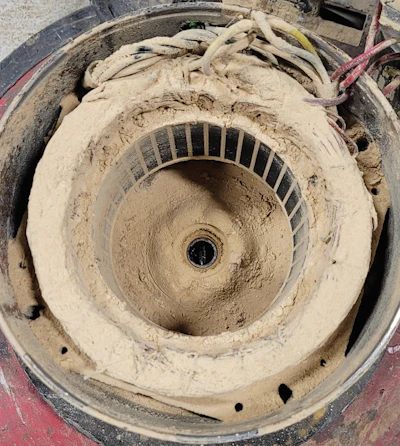The inside of a buffer motor full of dust. This and the dusty upper roller assembly could be easily prevented by simply blowing out the machines on a routine basis.