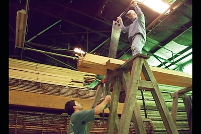 For flooring for an installation at Colonial Williamsburg, the antique heart pine flooring was created as it would have been in colonial times: the pitsaw. Two men work together in concert to pull the saw back and forth and cut the boards. (Taylor Moore III)