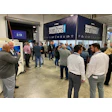 Manufacturing Solutions conference with professionals networking in industrial exhibition space