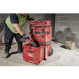 Red Milwaukee Packout tool storage system with power tool on construction site