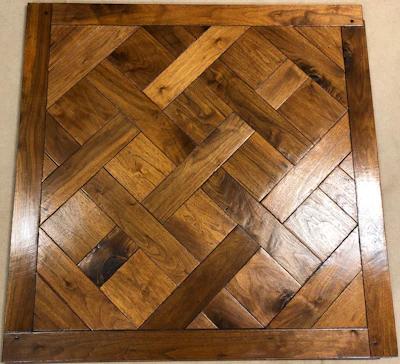 The Versailles parquet pattern in walnut.