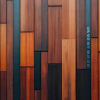 Modern wooden wall with geometric panels in orange, brown, and blue-gray tones