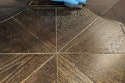 On this floor, you can see the plain background color around the perimeter and then the ceruse effect of gold mica dust in the next coat that remains in the open grain.