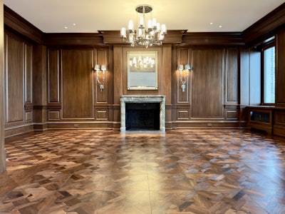Hand-scraped engineered black walnut fills this Chicago apartment.