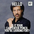 Curly-haired man in black shirt with humorous 'Hello, Carpenter Pencil' meme text