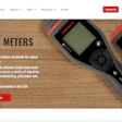 Delmhorst moisture meters on wooden background with digital display screens