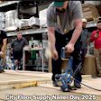 Workers using floor nailer equipment during City Floor Supply training event