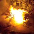 A still shot from a drone video from the Oak Island Fire Department shows the home completely engulfed in flames after oil-based stain rags spontaneously combusted.