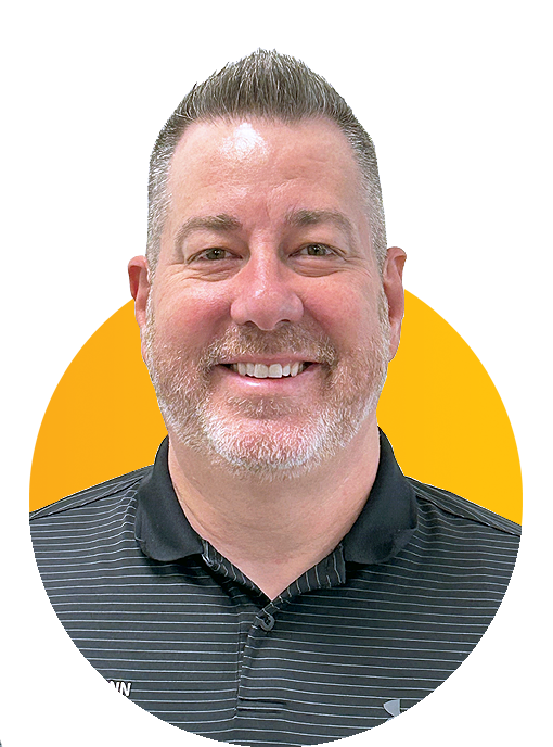 Smiling middle-aged man in striped polo shirt against yellow background