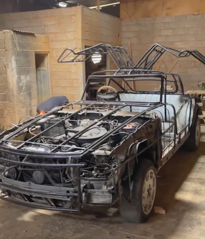 Le Forestier found a 1989 Mercedes E300, removed the body and built a metal skeleton onto which he could affix the wood.