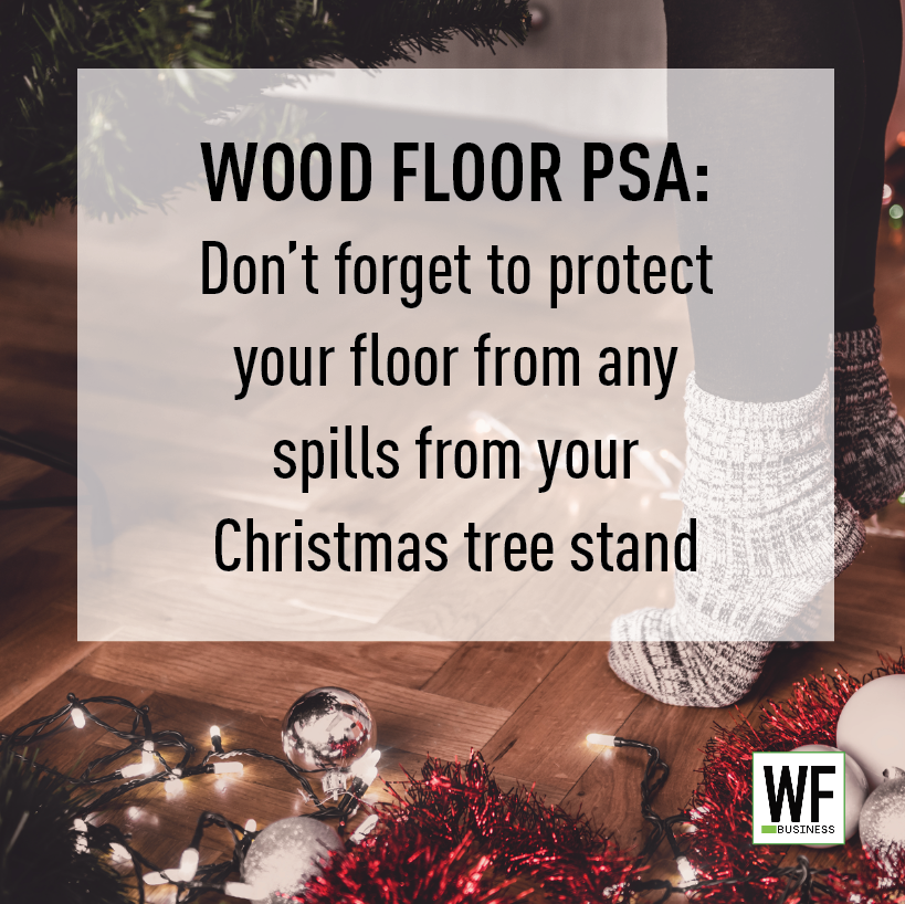 Wood floor Christmas warning with festive decorations and tree lights