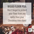 Wood floor Christmas warning with festive decorations and tree lights
