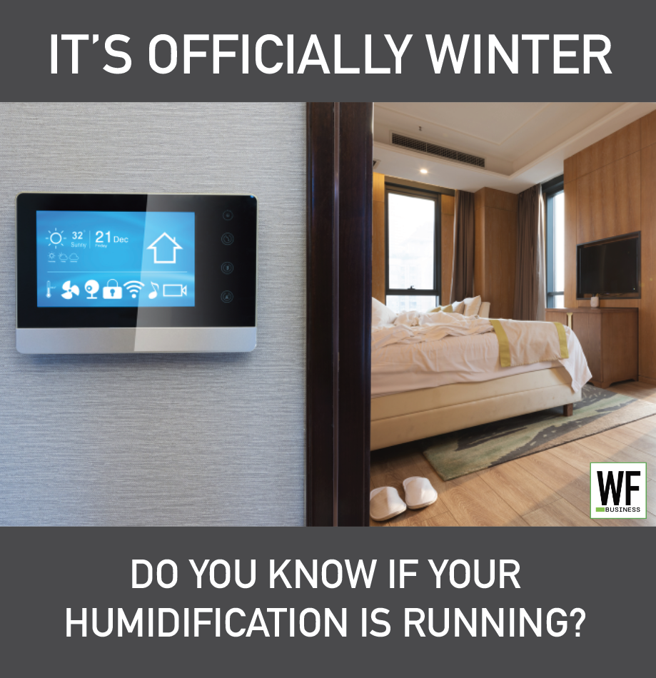 Smart home thermostat displaying winter temperature in modern bedroom