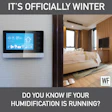 Smart home thermostat displaying winter temperature in modern bedroom