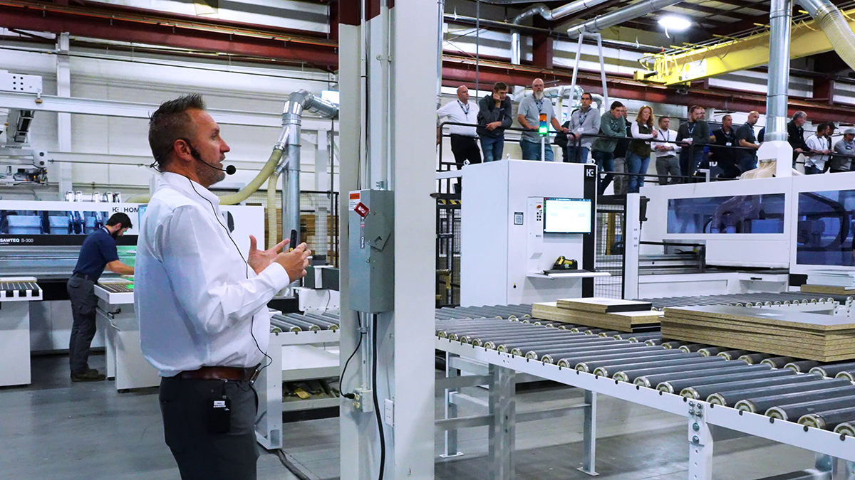 Manufacturing facility with worker operating machinery and production line