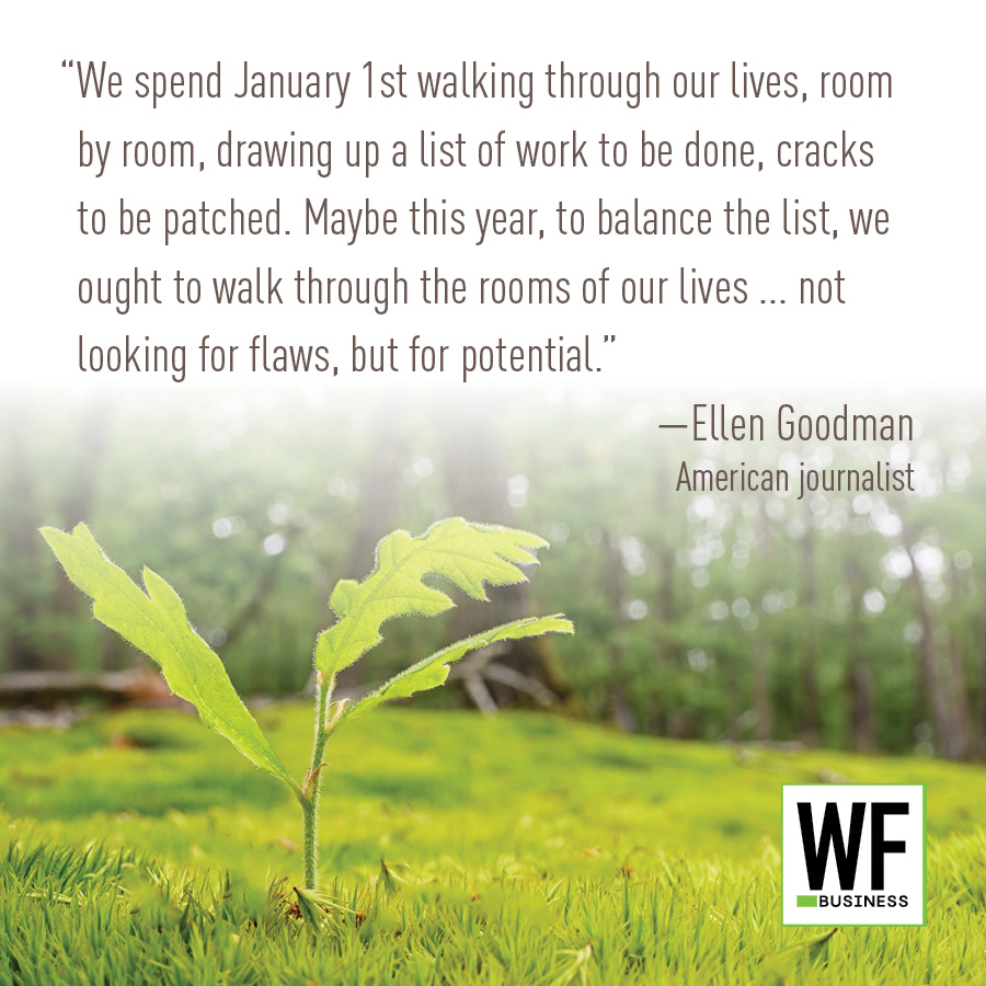 Young green plant sprout in grass with inspirational quote about potential