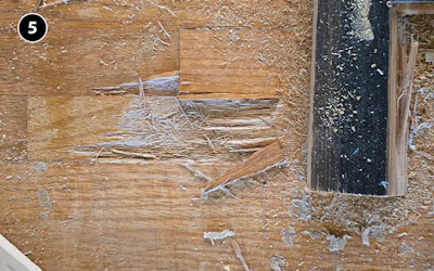 Above, the glue on the bamboo was pulling up some of the original oak boards right through the nails. Below, removing the boards going with the grain was less trauma for the original oak floor—we were able to save it this way.