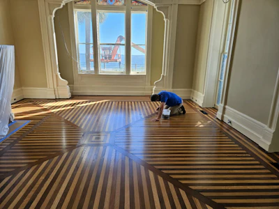 Drayton House's original white oak and walnut flooring after restoration.