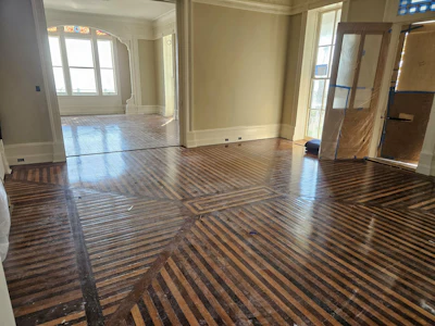 Drayton House's original white oak and walnut flooring before refinishing.